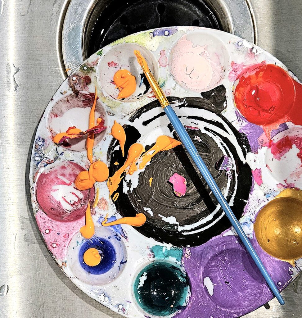 paint on palette in sink