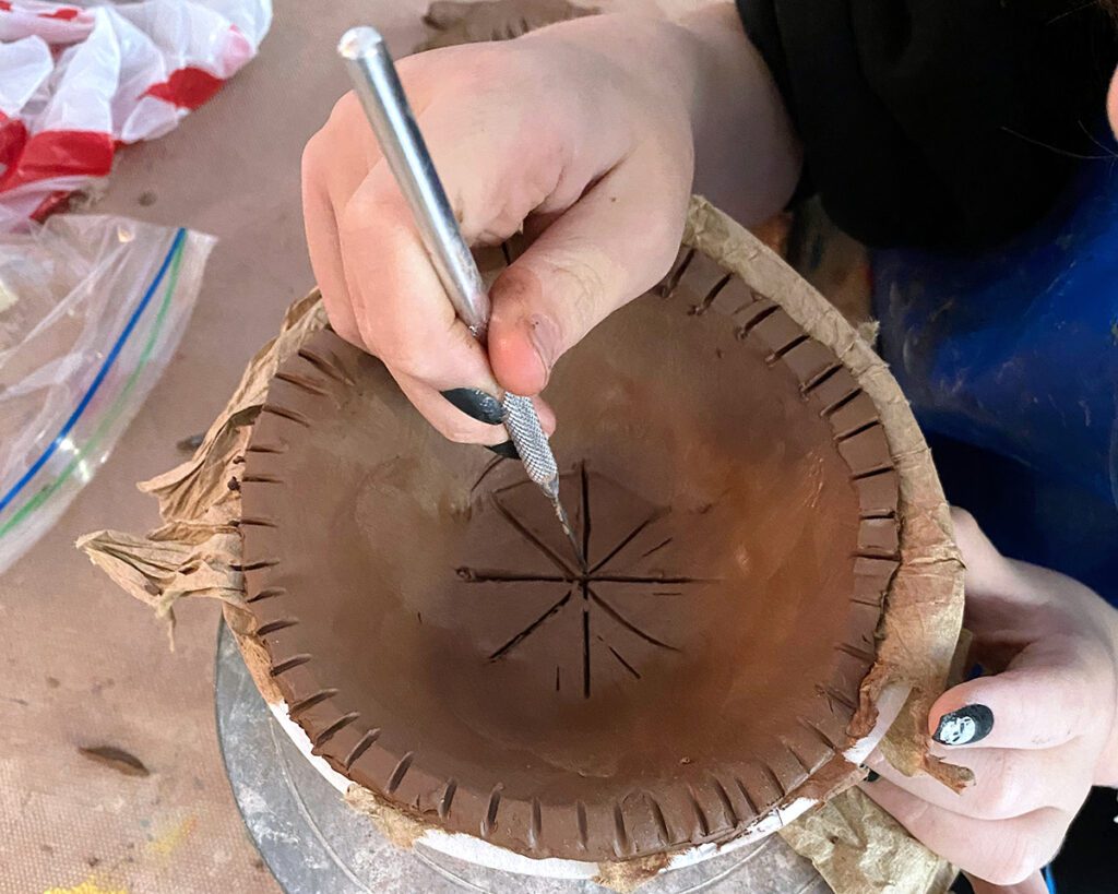 cutting into clay