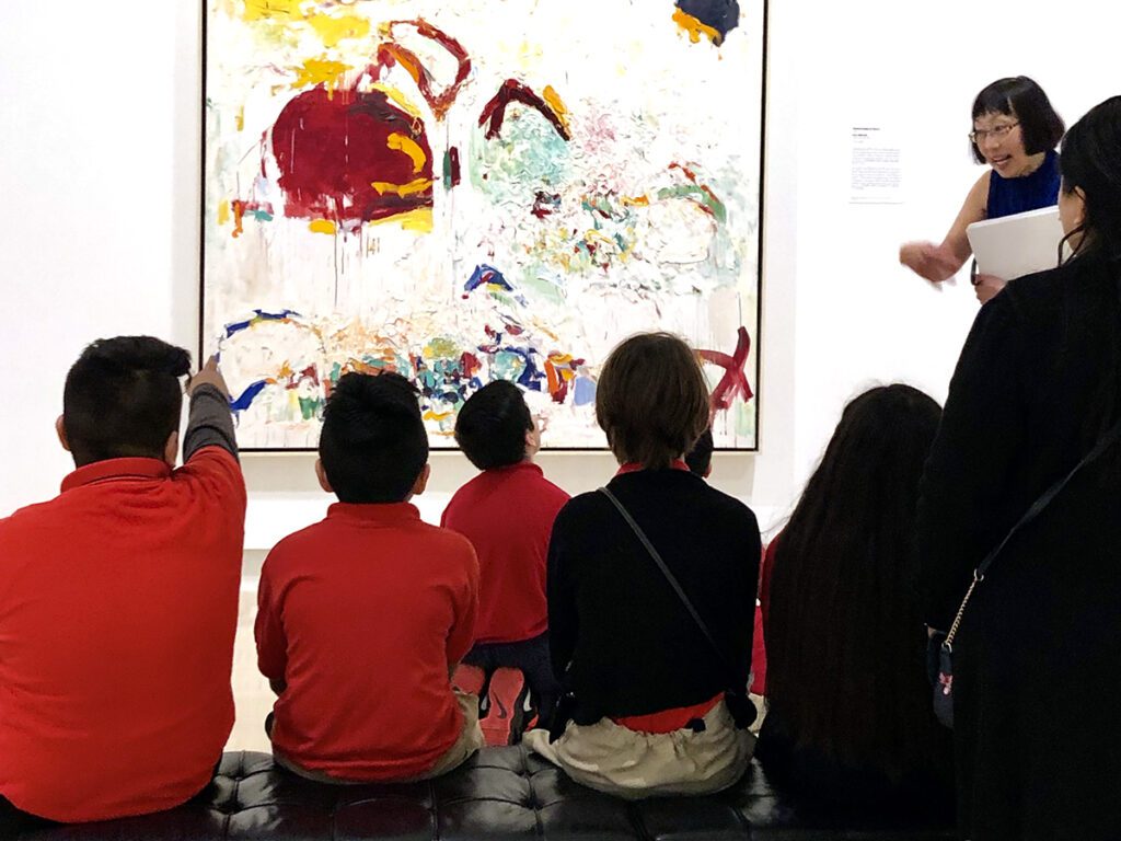 students looking at art in museum