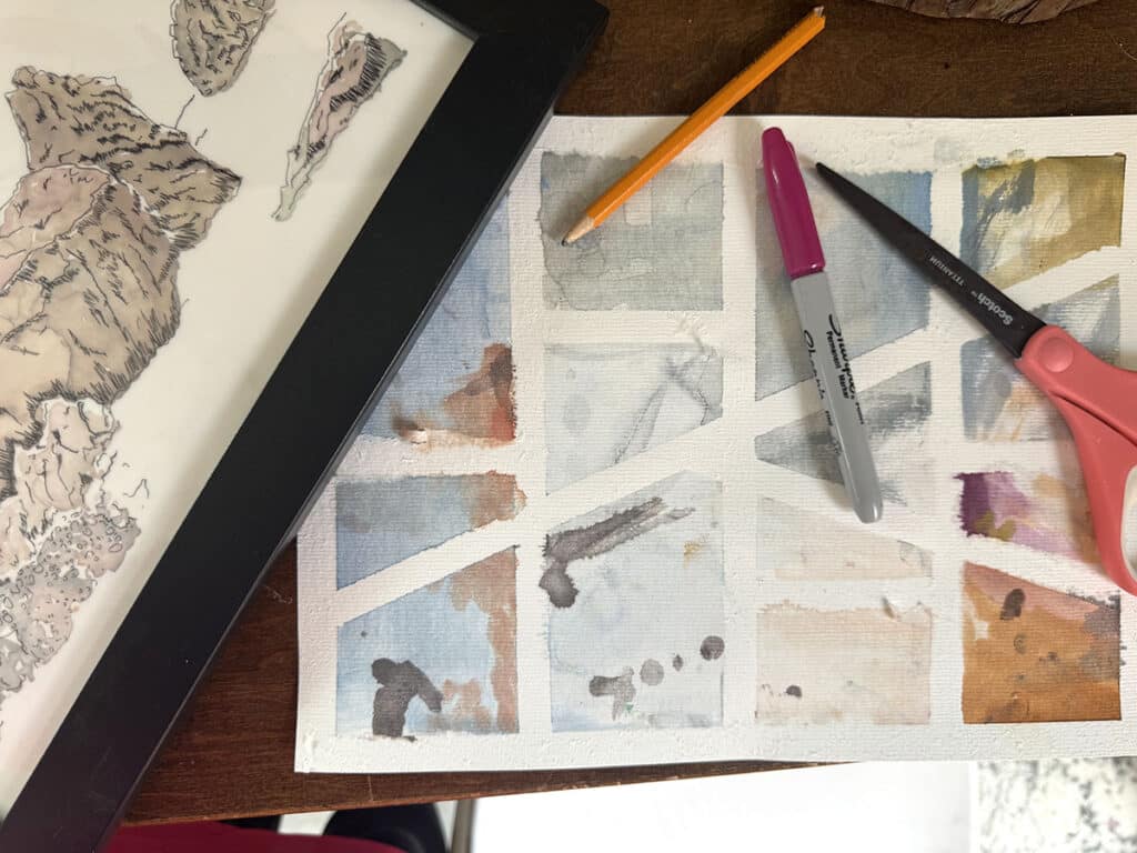 artwork with drawing utensils and scissors