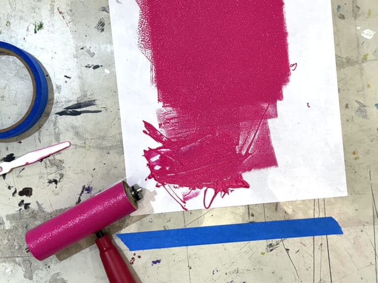 pink ink on paper and brayer