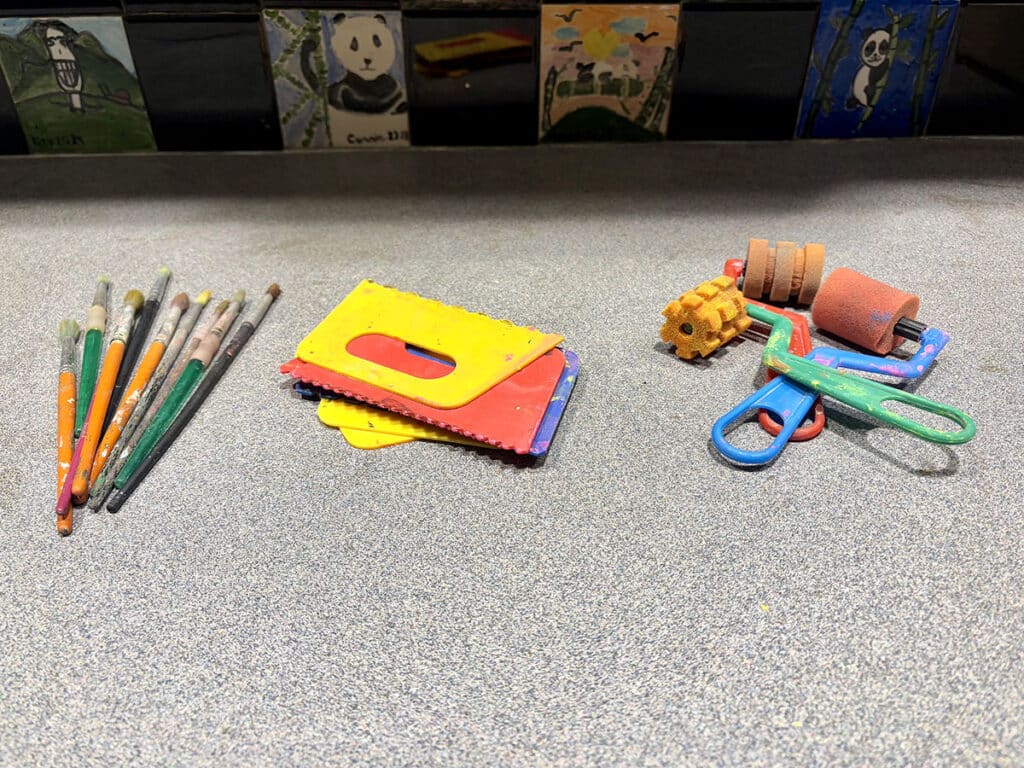 three piles of paintbrushes