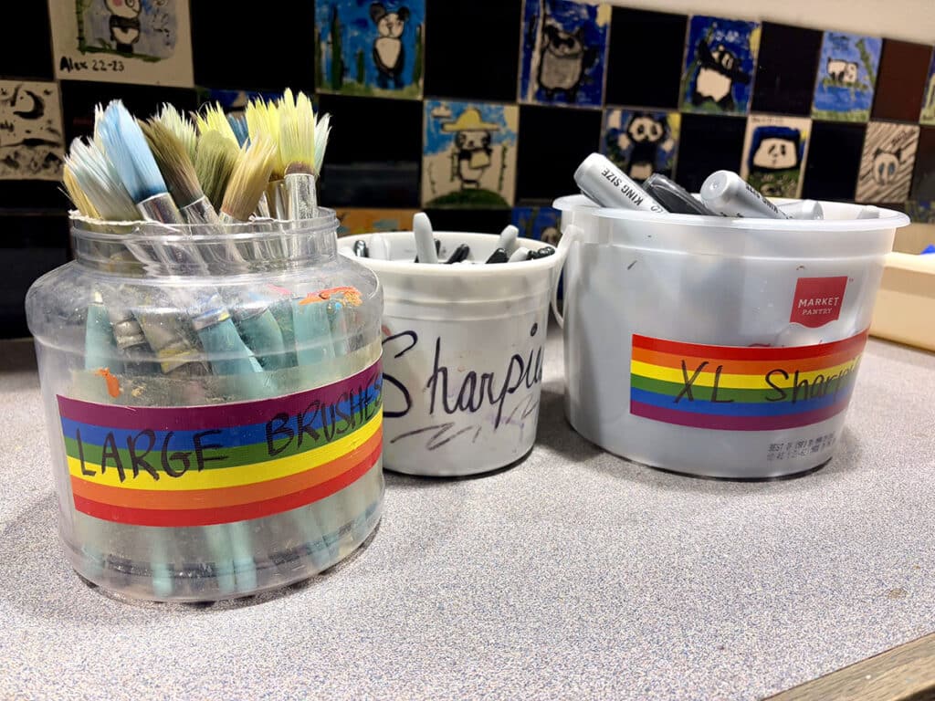 labeled containers of art supplies