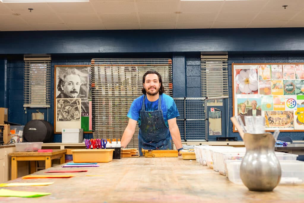 art teacher in classroom with prepped supplies