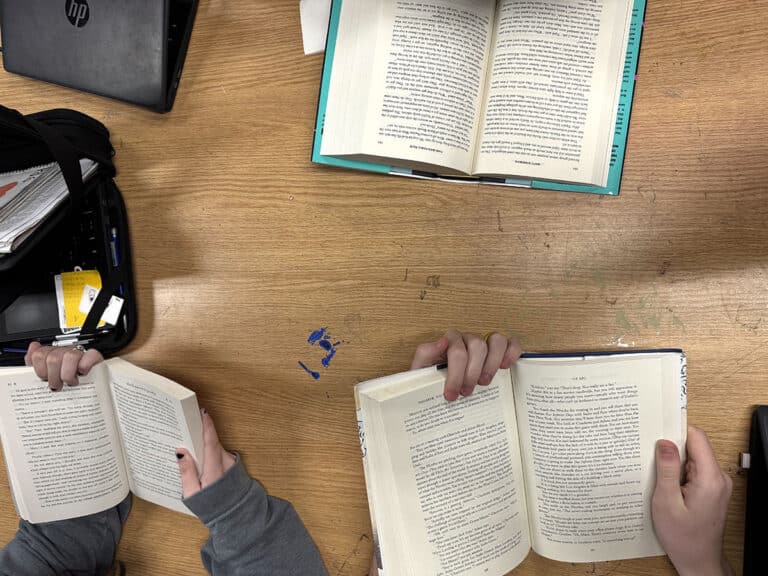 students hands reading books