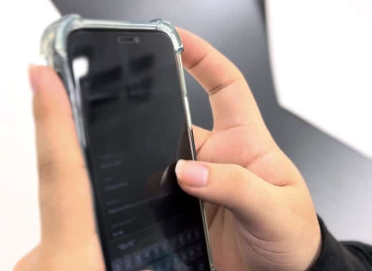 student holding a cell phone