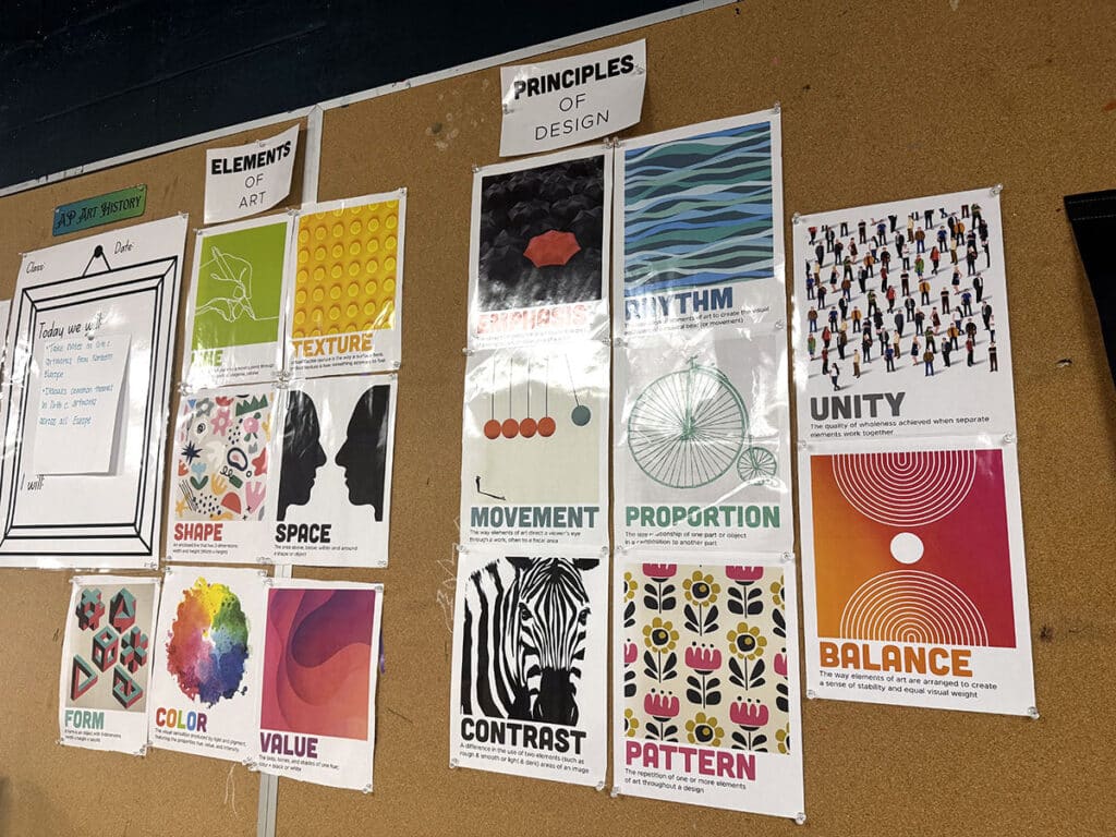 elements and principles posters on a board