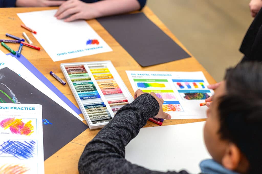 students making art with oil pastels