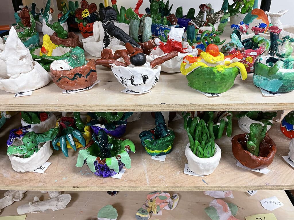 shelves of small ceramic pots