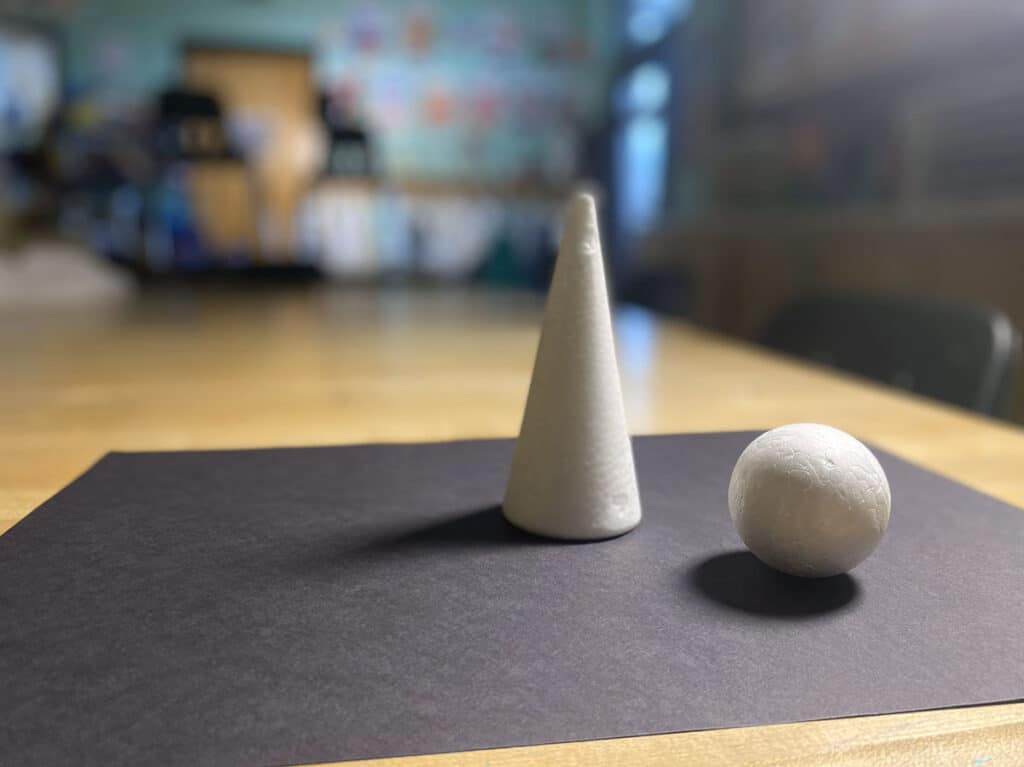 white forms with a cone and sphere for drawing
