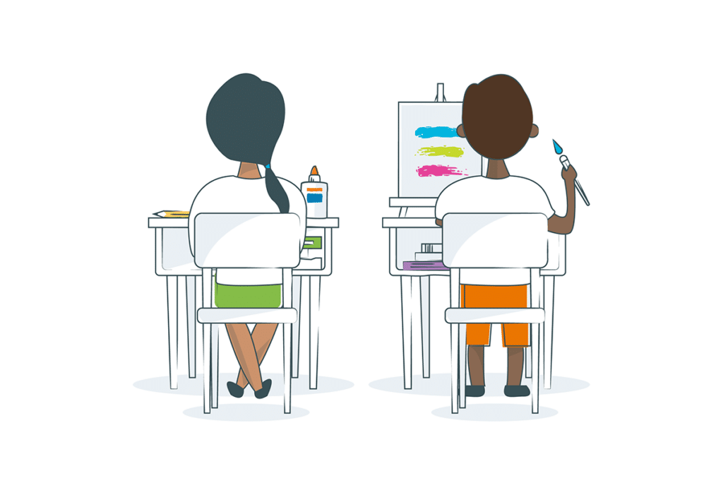 two students at desks making art