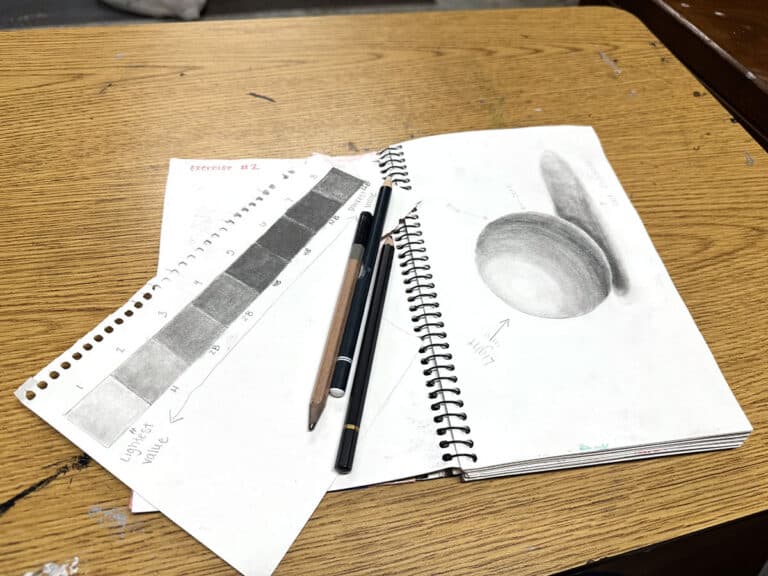 sketchbook with graphite sphere and value scales