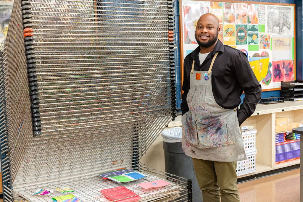 teacher next to a drying rack