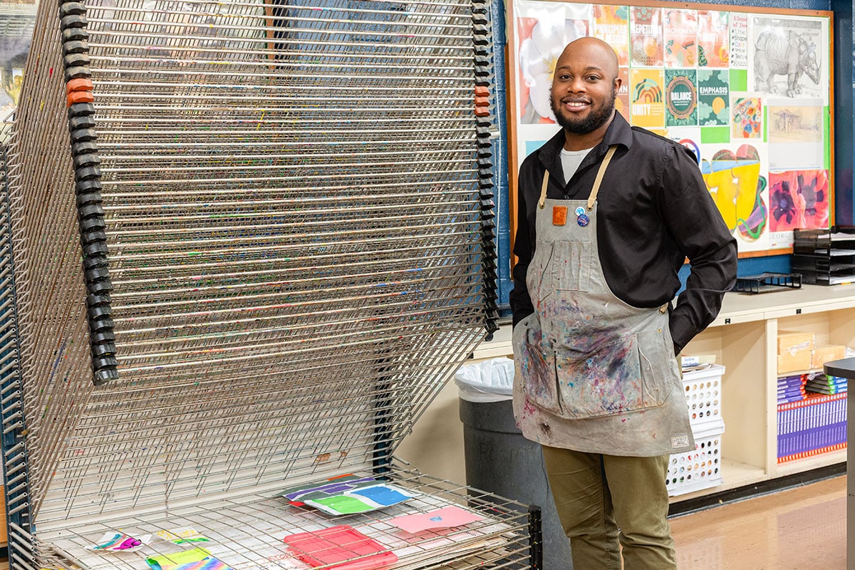 teacher next to a drying rack