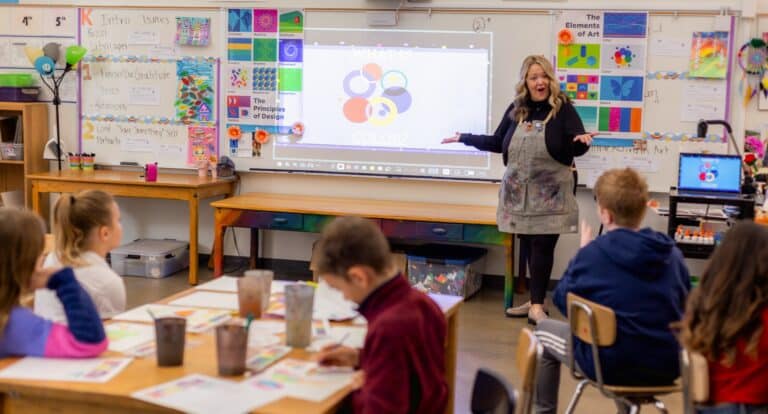 art teacher teaching in front of a group of students