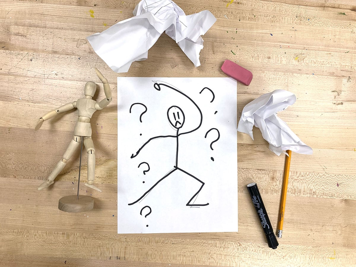 mannequin, stick figure drawing, and art supplies