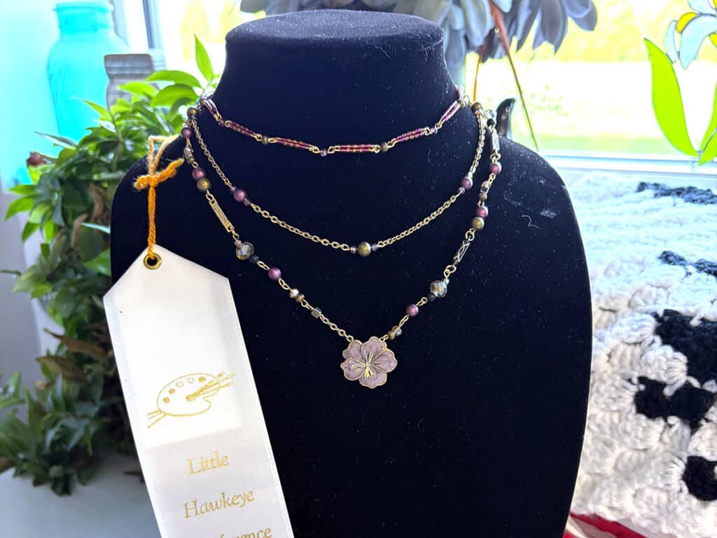 necklace with a white ribbon
