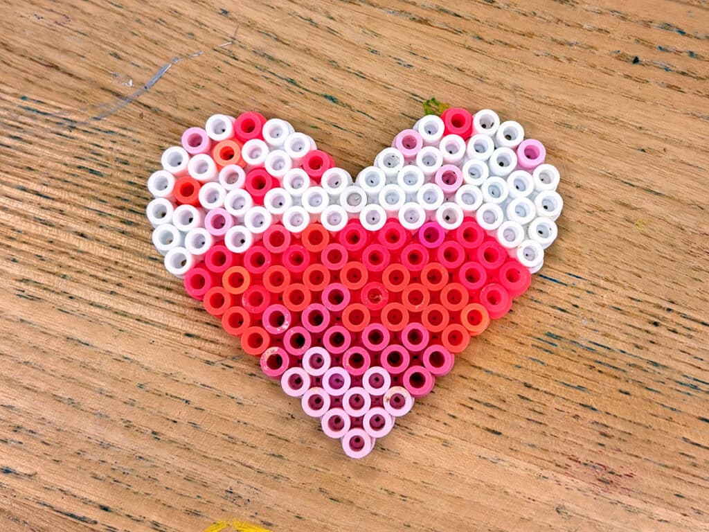 melting plastic beads in a heart