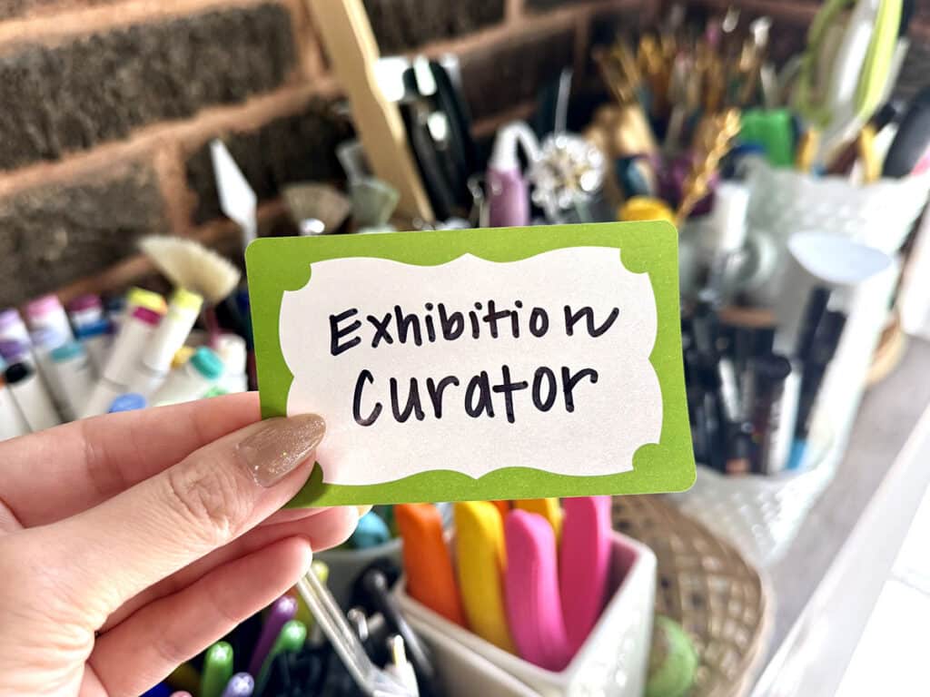 name tag with exhibition curator