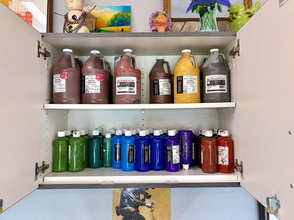 paint bottles in a cabinet