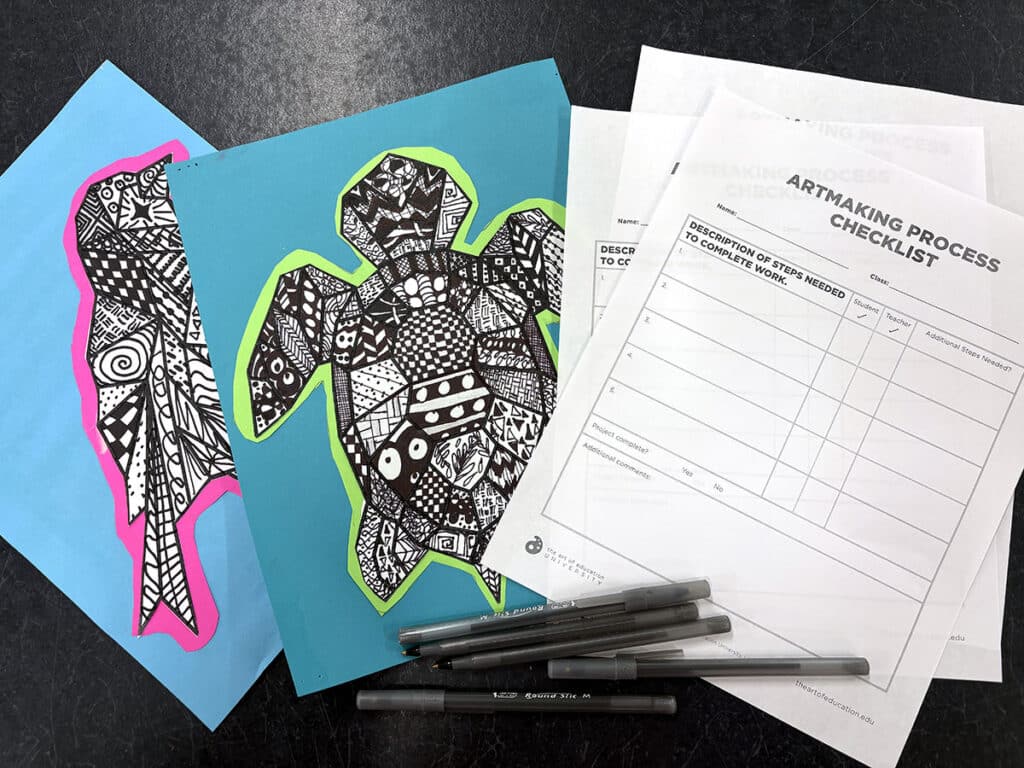 artmaking process checklist with artwork and pens
