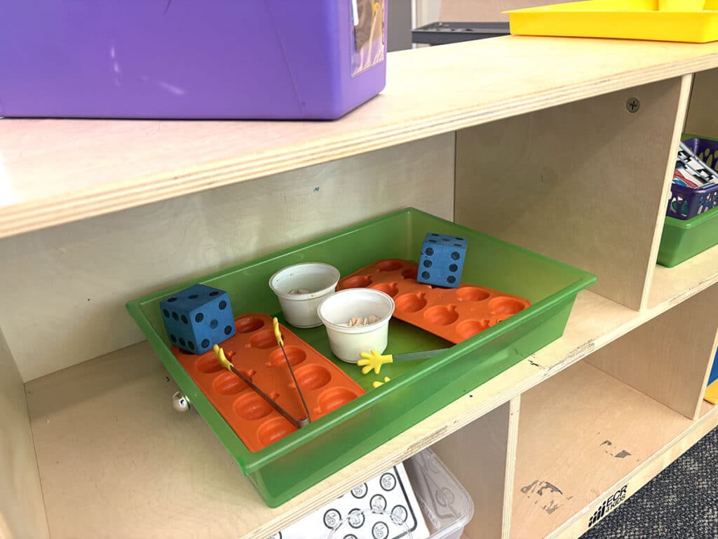 supplies in a tray on the shelf